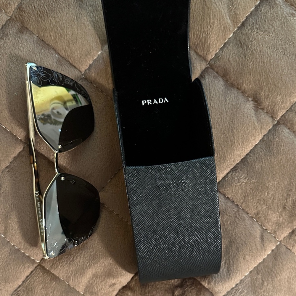 Prada Elegant Black Sunglasses with Floral Detail B-108